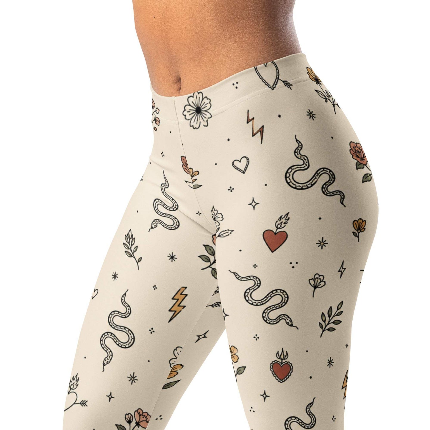 Minimal tattoo flash leggings with tiny suns, hearts, snakes, flowers, and lightning bolts