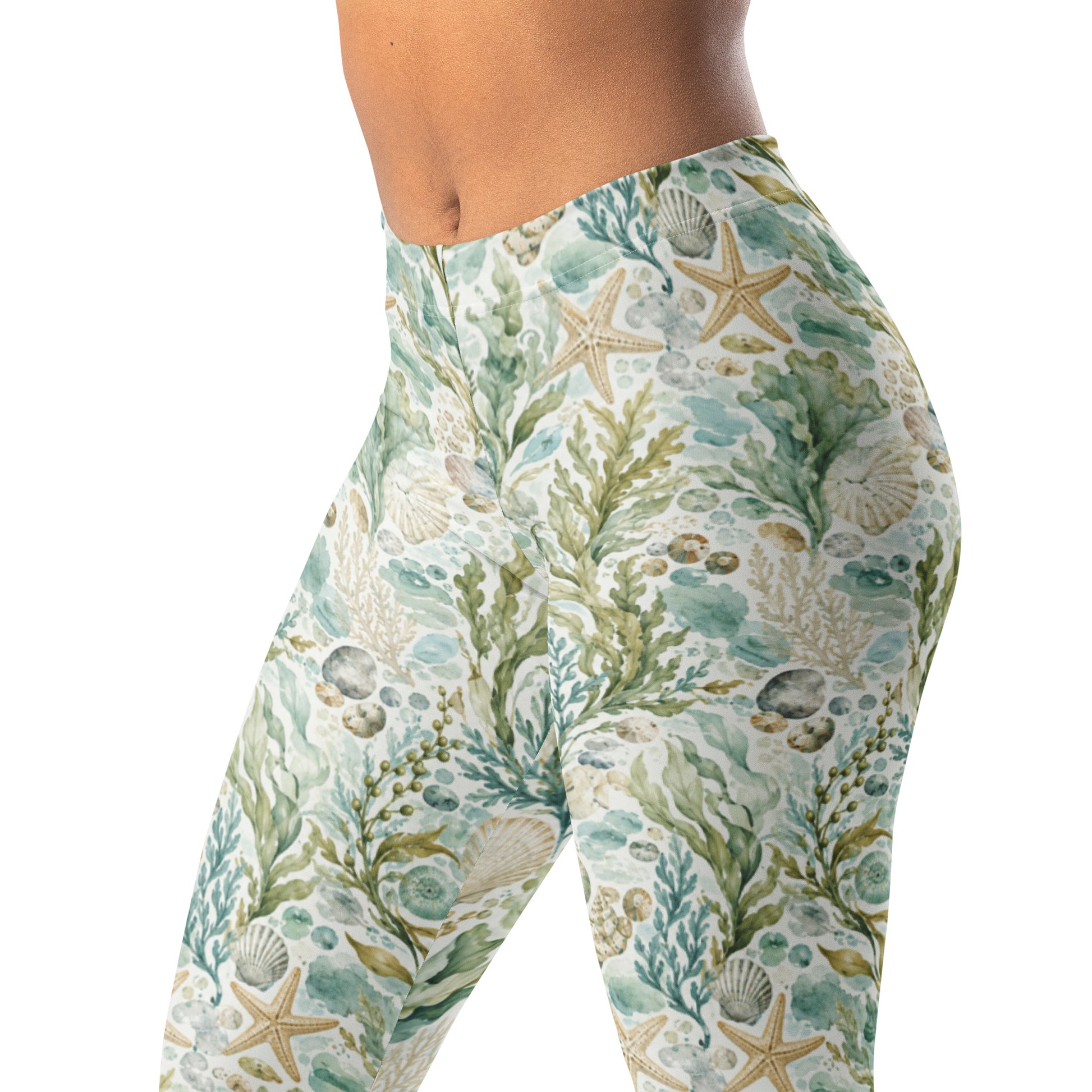 Tidepool botanical leggings with seaweed, shells, starfish, and blue-green water marks