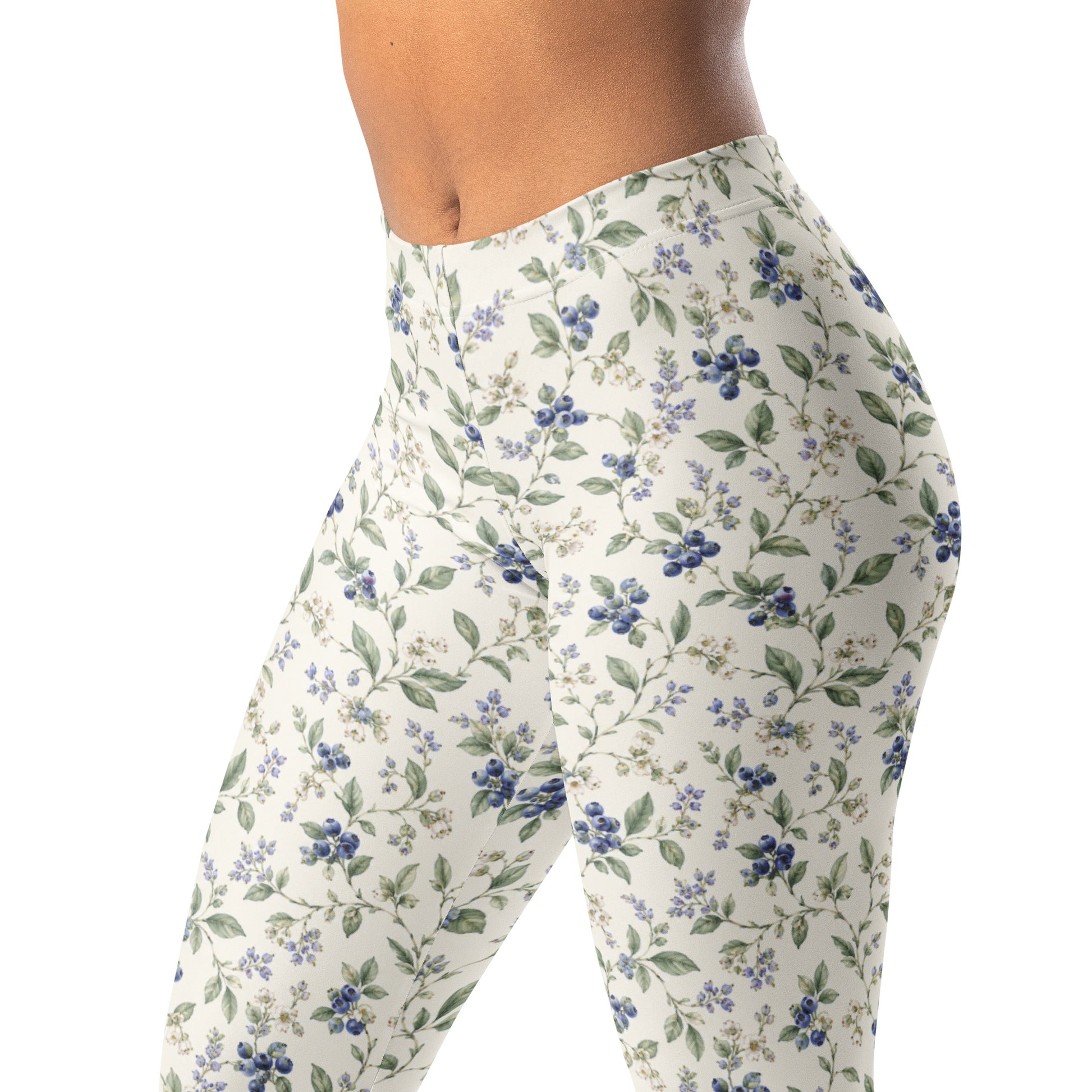 Blueberry vine leggings with tiny blueberries and pale blossoms on ivory