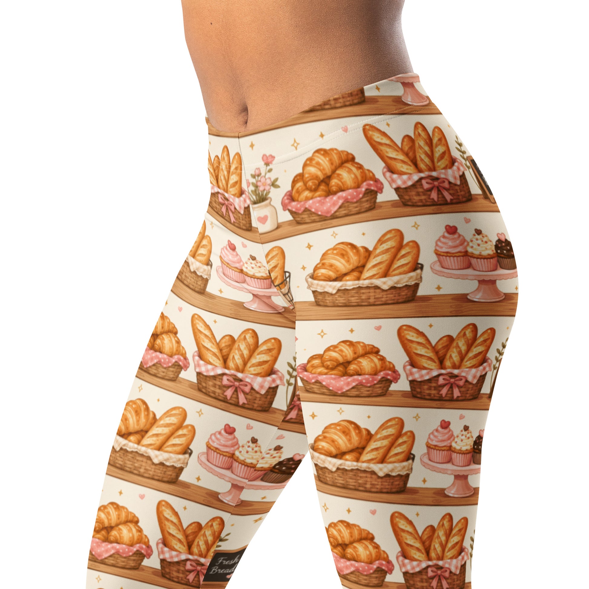 Bakery shelf leggings with croissants, baguettes, cupcakes, and sparkle icons