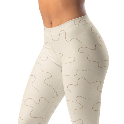 Neutral squiggle leggings with thin irregular lines in brown and cream