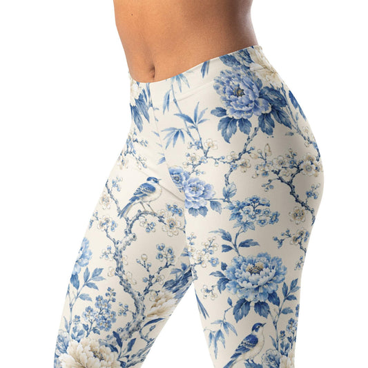 Chinoiserie garden leggings with birds, branches, and florals in soft blue and cream